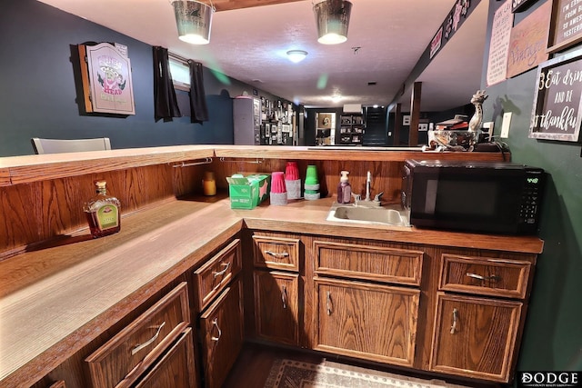1131 Elizabeth Cir, Fremont, NE 68025 - bar area with black microwave and a sink