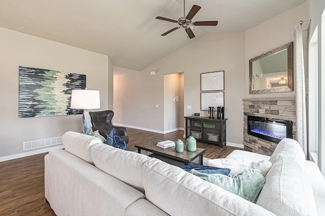 6413 N 168th Ave, Omaha, NE 68116 - living room with a ceiling fan, dark wood-style floors, lofted ceiling, a stone fireplace, and baseboards