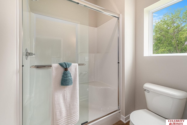 6413 N 168th Ave, Omaha, NE 68116 - bathroom with a stall shower and toilet