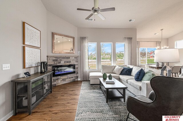 6413 N 168th Ave, Omaha, NE 68116 - living room with wood finished floors, a ceiling fan, and a stone fireplace