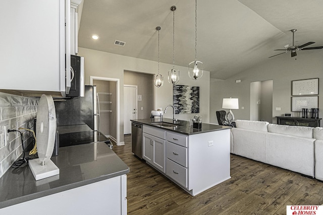 6405 N 168th Ave, Omaha, NE 68116 - kitchen with a sink, dishwasher, dark countertops, dark wood-style floors, and lofted ceiling