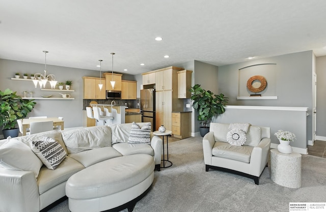 7211 S 174th St, Omaha, NE 68136 - living area featuring recessed lighting, a chandelier, baseboards, and light colored carpet
