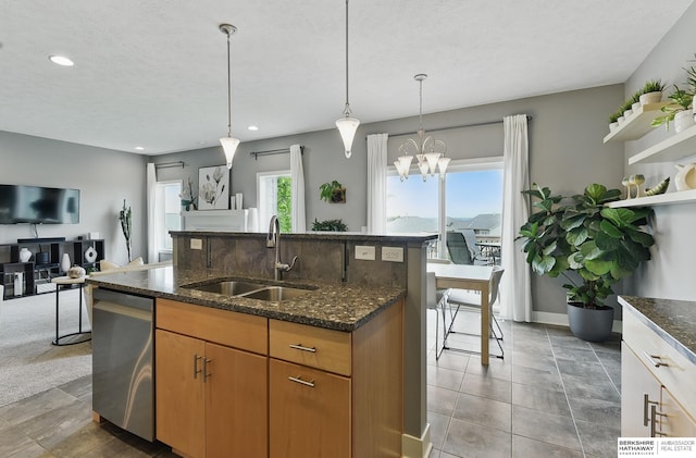 7211 S 174th St, Omaha, NE 68136 - kitchen with a sink, stainless steel dishwasher, dark stone counters, a kitchen island with sink, and recessed lighting
