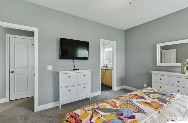 7211 S 174th St, Omaha, NE 68136 - bedroom featuring dark colored carpet, baseboards, and ensuite bath