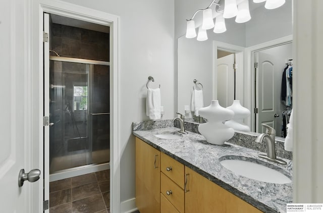 7211 S 174th St, Omaha, NE 68136 - full bathroom featuring double vanity, a shower stall, and baseboards