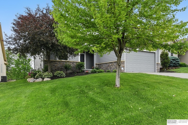 7211 S 174th St, Omaha, NE 68136 - obstructed view of property with stone siding, concrete driveway, a front lawn, and central AC unit