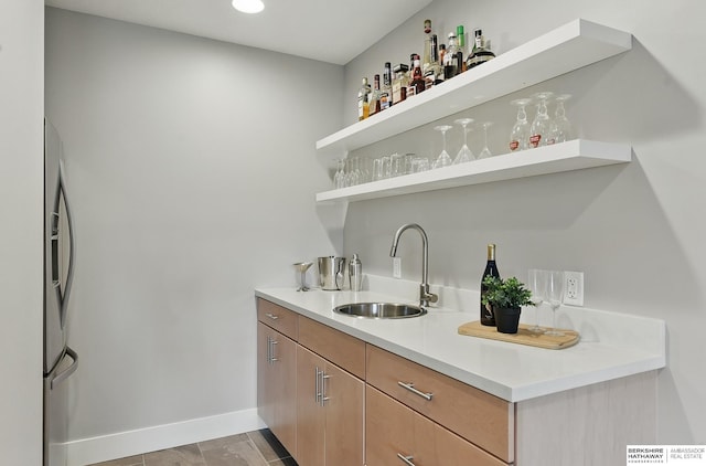 7211 S 174th St, Omaha, NE 68136 - indoor wet bar featuring baseboards and stainless steel fridge