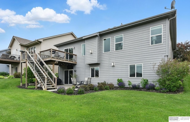 7211 S 174th St, Omaha, NE 68136 - rear view of house with a deck, a lawn, and stairs