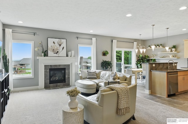 7211 S 174th St, Omaha, NE 68136 - living area featuring recessed lighting, a fireplace, baseboards, and light colored carpet