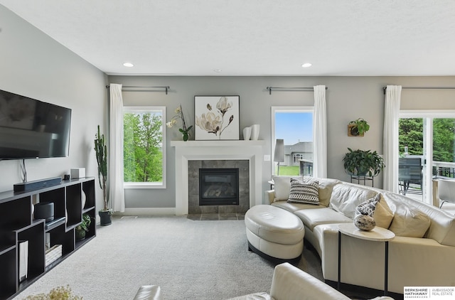 7211 S 174th St, Omaha, NE 68136 - living room featuring carpet flooring, healthy amount of natural light, a tile fireplace, and recessed lighting