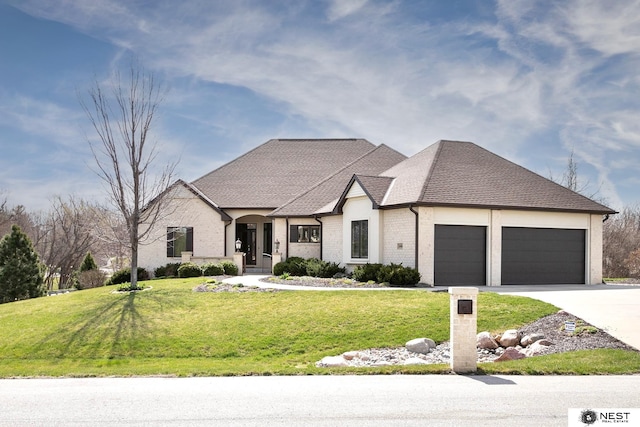 3400 Firethorn Ter, Lincoln, NE 68520 - french country home featuring a garage, a front yard, driveway, and brick siding