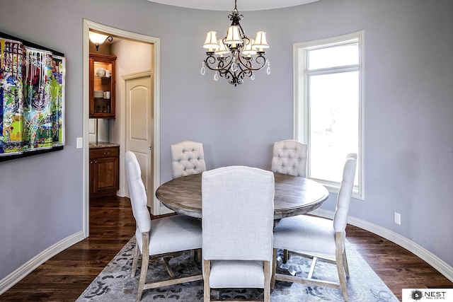 3400 Firethorn Ter, Lincoln, NE 68520 - dining room with a chandelier, dark wood finished floors, and baseboards
