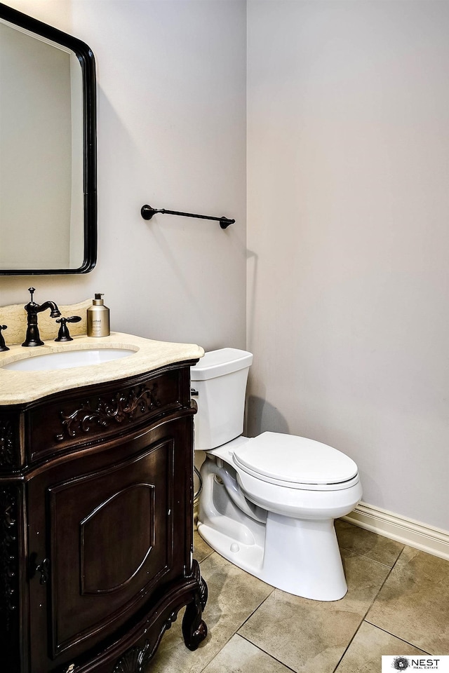 3400 Firethorn Ter, Lincoln, NE 68520 - half bath with tile patterned flooring, toilet, and vanity