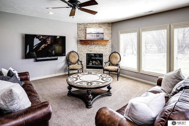 3400 Firethorn Ter, Lincoln, NE 68520 - living area with baseboards, a ceiling fan, carpet, and a stone fireplace