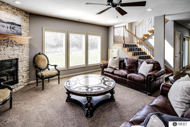 3400 Firethorn Ter, Lincoln, NE 68520 - carpeted living area featuring a ceiling fan, stairs, a fireplace, baseboards, and recessed lighting