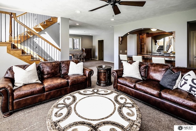 3400 Firethorn Ter, Lincoln, NE 68520 - living area featuring stairs, carpet floors, a ceiling fan, arched walkways, and recessed lighting