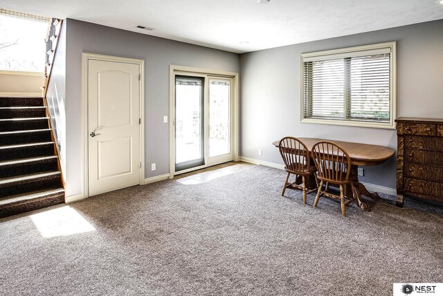 3400 Firethorn Ter, Lincoln, NE 68520 - carpeted dining room with stairway, plenty of natural light, and baseboards