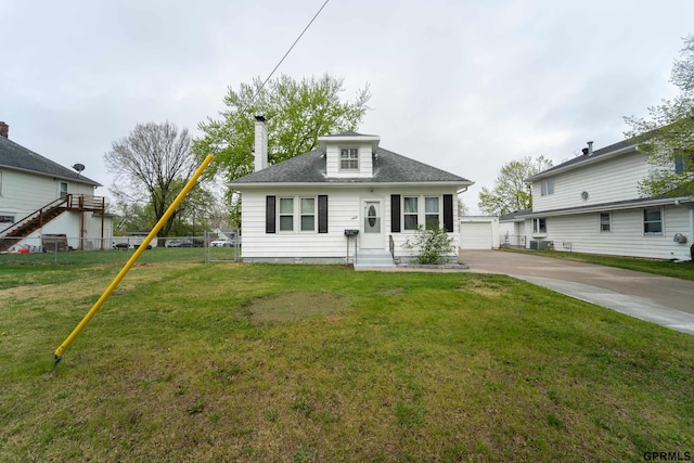 1822 N 60th St, Omaha, NE 68104 - view of front of property featuring entry steps, roof with shingles, an outbuilding, and a garage