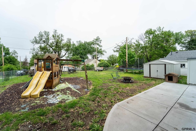 1822 N 60th St, Omaha, NE 68104 - view of yard with a playground and an outdoor fire pit