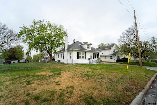 1822 N 60th St, Omaha, NE 68104 - view of side of home with a chimney and roof with shingles