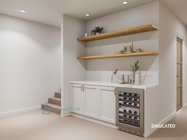 indoor bar featuring beverage cooler, light carpet, baseboards, recessed lighting, and stairway