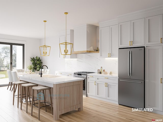kitchen featuring stainless steel appliances, a sink, decorative backsplash, light wood-style floors, and a breakfast bar area