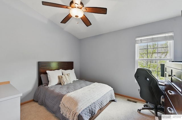 6031 N 167th Ct, Omaha, NE 68116 - carpeted bedroom featuring a desk, baseboards, vaulted ceiling, and ceiling fan