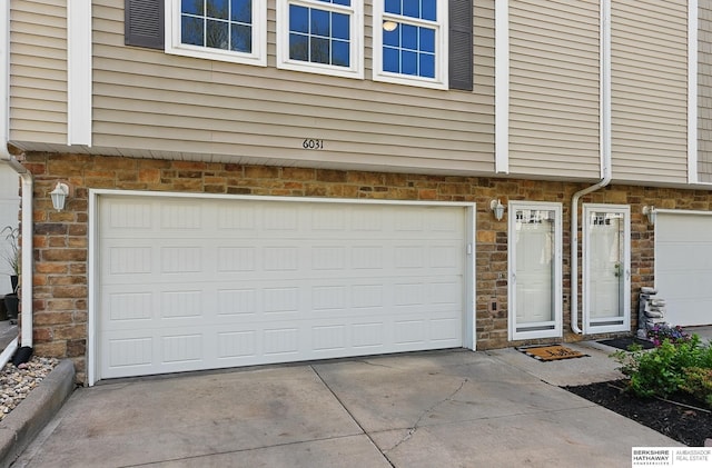 6031 N 167th Ct, Omaha, NE 68116 - garage featuring concrete driveway