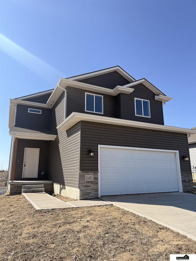 view of front of house with an attached garage and driveway