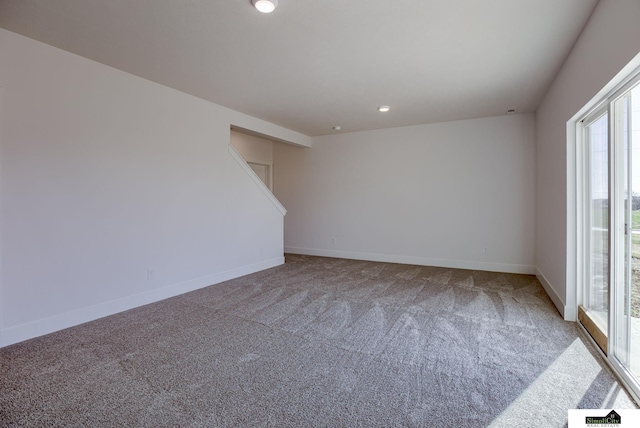 carpeted spare room with baseboards and recessed lighting
