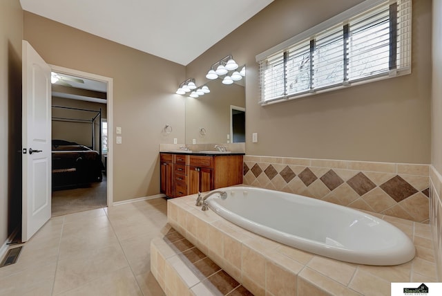 8420 Augusta Dr, Lincoln, NE 68526 - ensuite bathroom with a bath, double vanity, tile patterned floors, and baseboards