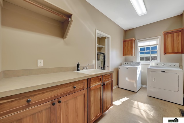 8420 Augusta Dr, Lincoln, NE 68526 - laundry area with cabinet space, washing machine and clothes dryer, and light flooring