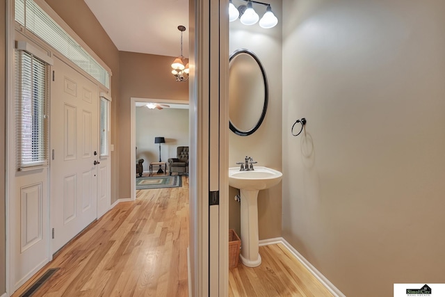8420 Augusta Dr, Lincoln, NE 68526 - bathroom with wood finished floors, baseboards, and a sink