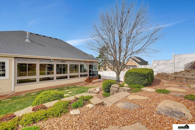 8420 Augusta Dr, Lincoln, NE 68526 - back of house with stucco siding and a sunroom