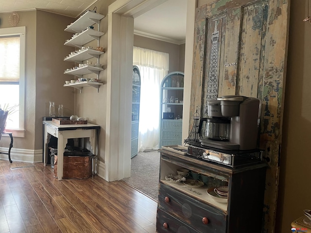 803 6th St, Fairbury, NE 68352 - kitchen with crown molding, wood finished floors, baseboards, and open shelves
