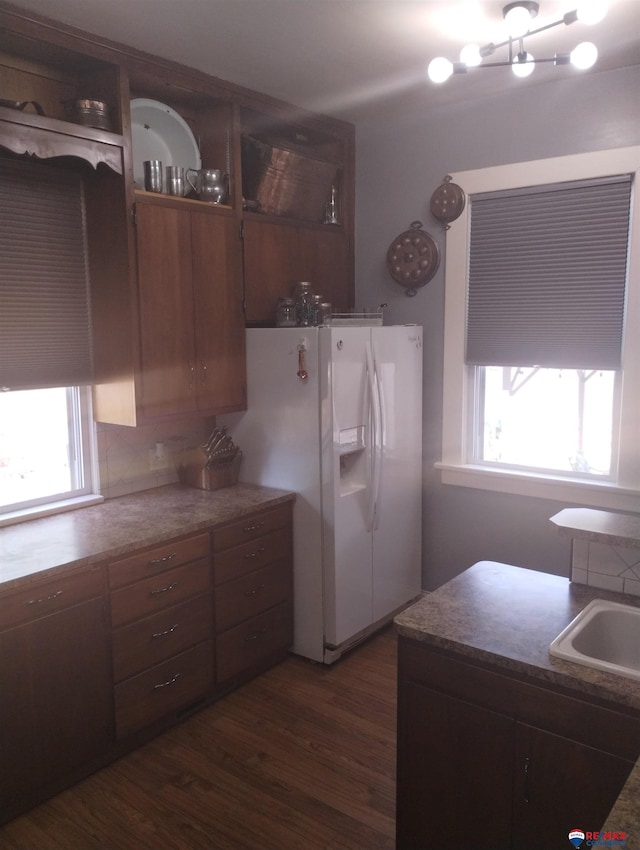 803 6th St, Fairbury, NE 68352 - kitchen with white fridge with ice dispenser, dark wood-type flooring, and decorative backsplash