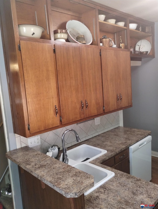 803 6th St, Fairbury, NE 68352 - kitchen with dishwasher, tasteful backsplash, and brown cabinets