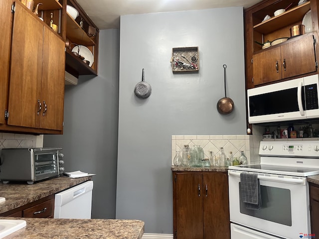803 6th St, Fairbury, NE 68352 - kitchen with white appliances, open shelves, backsplash, and brown cabinets