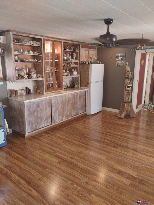 803 6th St, Fairbury, NE 68352 - bar with freestanding refrigerator, wood finished floors, and a ceiling fan