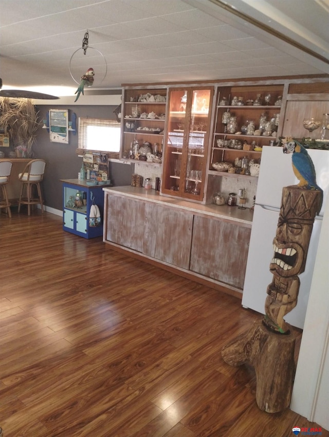 803 6th St, Fairbury, NE 68352 - bar area featuring freestanding refrigerator and dark wood-style flooring