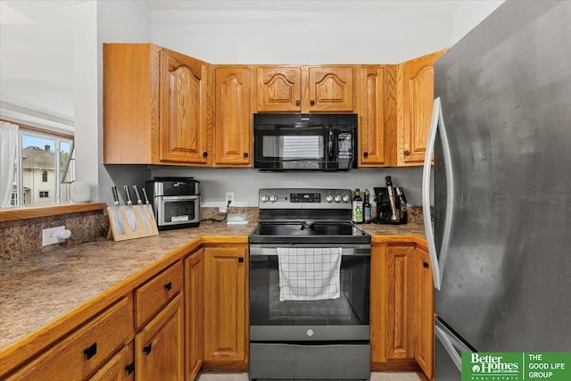 4188 Chicago St, Omaha, NE 68131 - kitchen featuring stainless steel appliances, brown cabinets, and light countertops