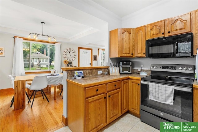 4188 Chicago St, Omaha, NE 68131 - kitchen featuring black microwave, electric stove, a peninsula, brown cabinets, and light wood finished floors