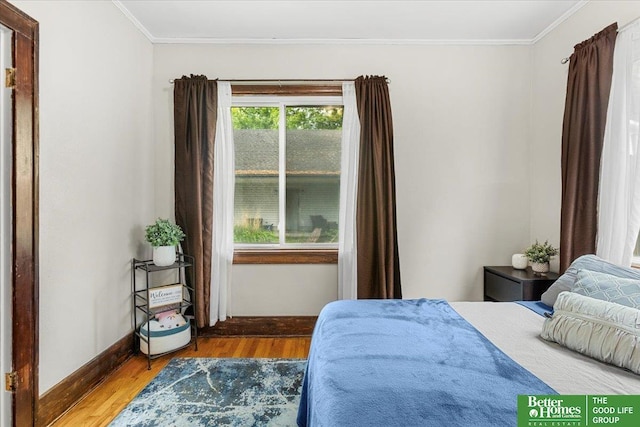 4188 Chicago St, Omaha, NE 68131 - bedroom with wood finished floors, baseboards, and ornamental molding
