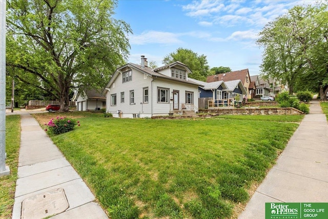 4188 Chicago St, Omaha, NE 68131 - view of front of house with a front lawn and a chimney