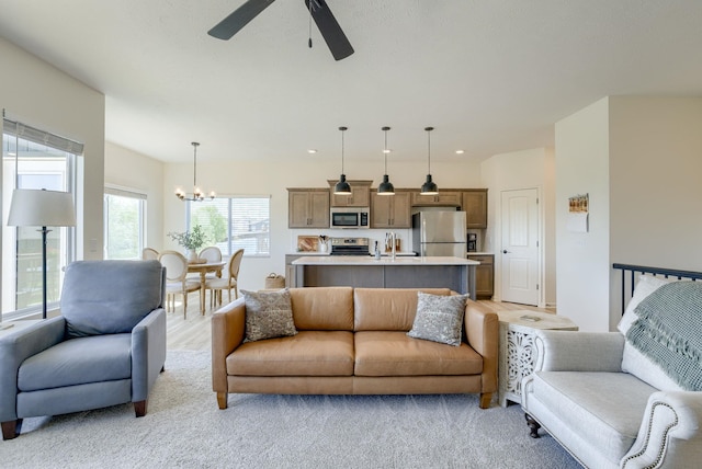 9221 S 177th St, Omaha, NE 68136 - living room with a chandelier, ceiling fan, light carpet, and recessed lighting