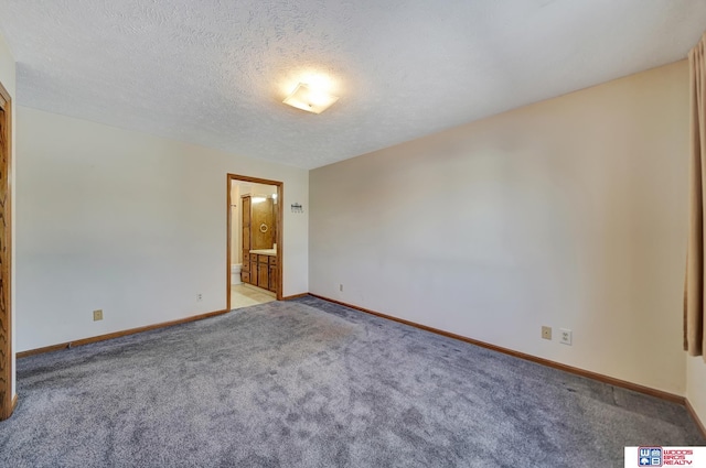 4932 High St, Lincoln, NE 68506 - spare room with light colored carpet, baseboards, and a textured ceiling
