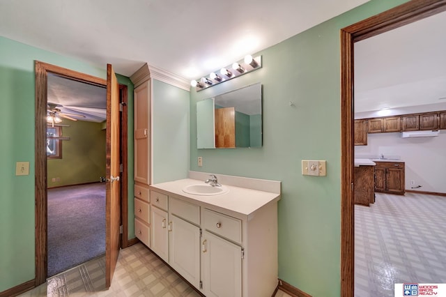 4932 High St, Lincoln, NE 68506 - bathroom with tile patterned floors, vanity, baseboards, and a ceiling fan