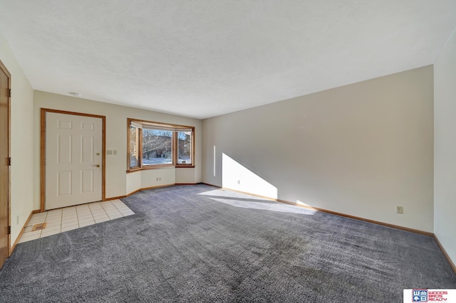 4932 High St, Lincoln, NE 68506 - unfurnished living room featuring carpet floors and baseboards