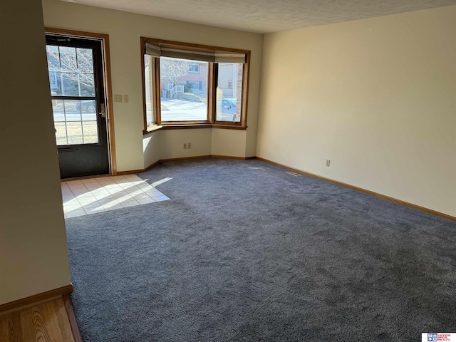 4932 High St, Lincoln, NE 68506 - carpeted spare room featuring healthy amount of natural light and baseboards
