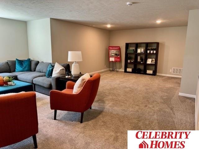 living area featuring carpet floors, a textured ceiling, baseboards, and recessed lighting